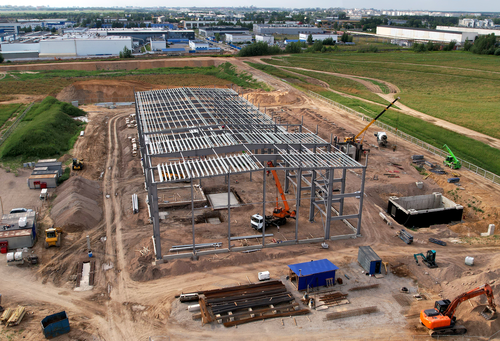construction,of,warehouse,from,metal,structures.,industrial,building,on,light