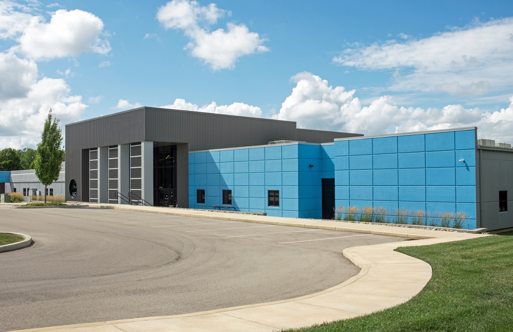 contemporary,blue,and,gray,business,building,with,curved,drive