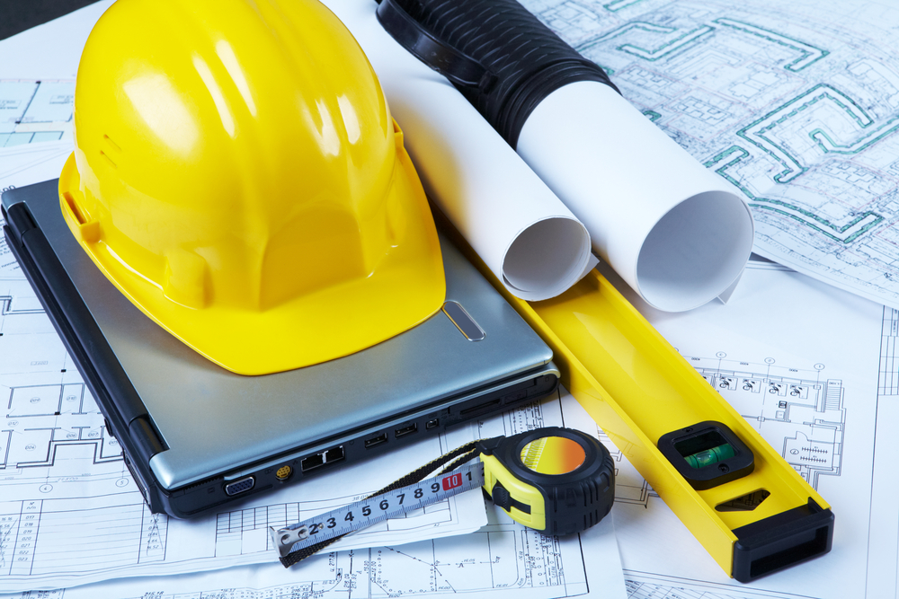 photo,of,helmet,,laptop,,barrel,,ruler,,drawing,scale,and,architectural