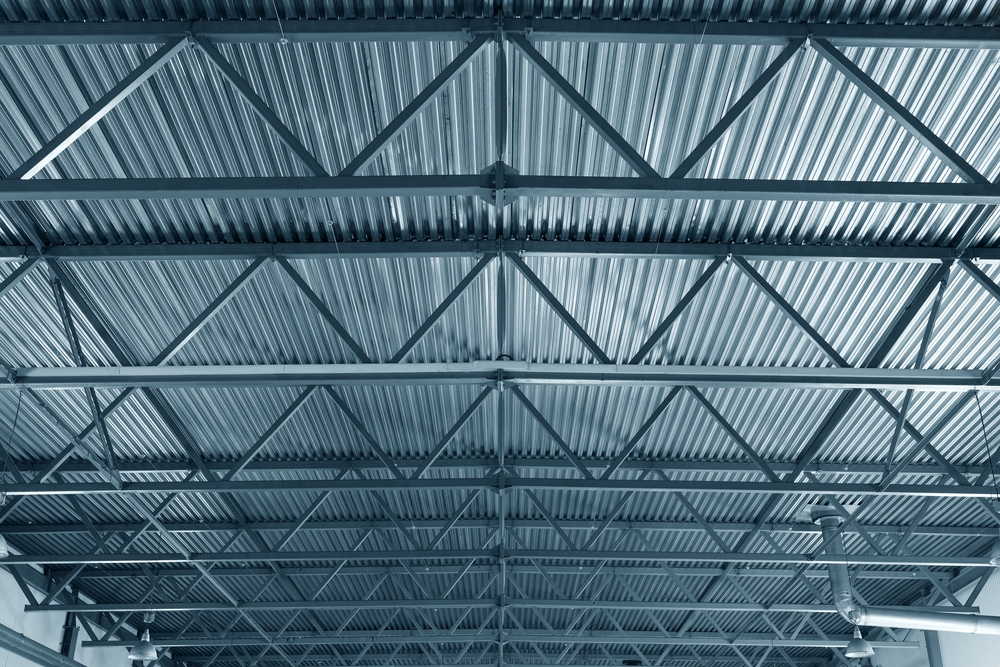 roof,or,metal,ceiling,of,industrial,premises.,inside,view.,from